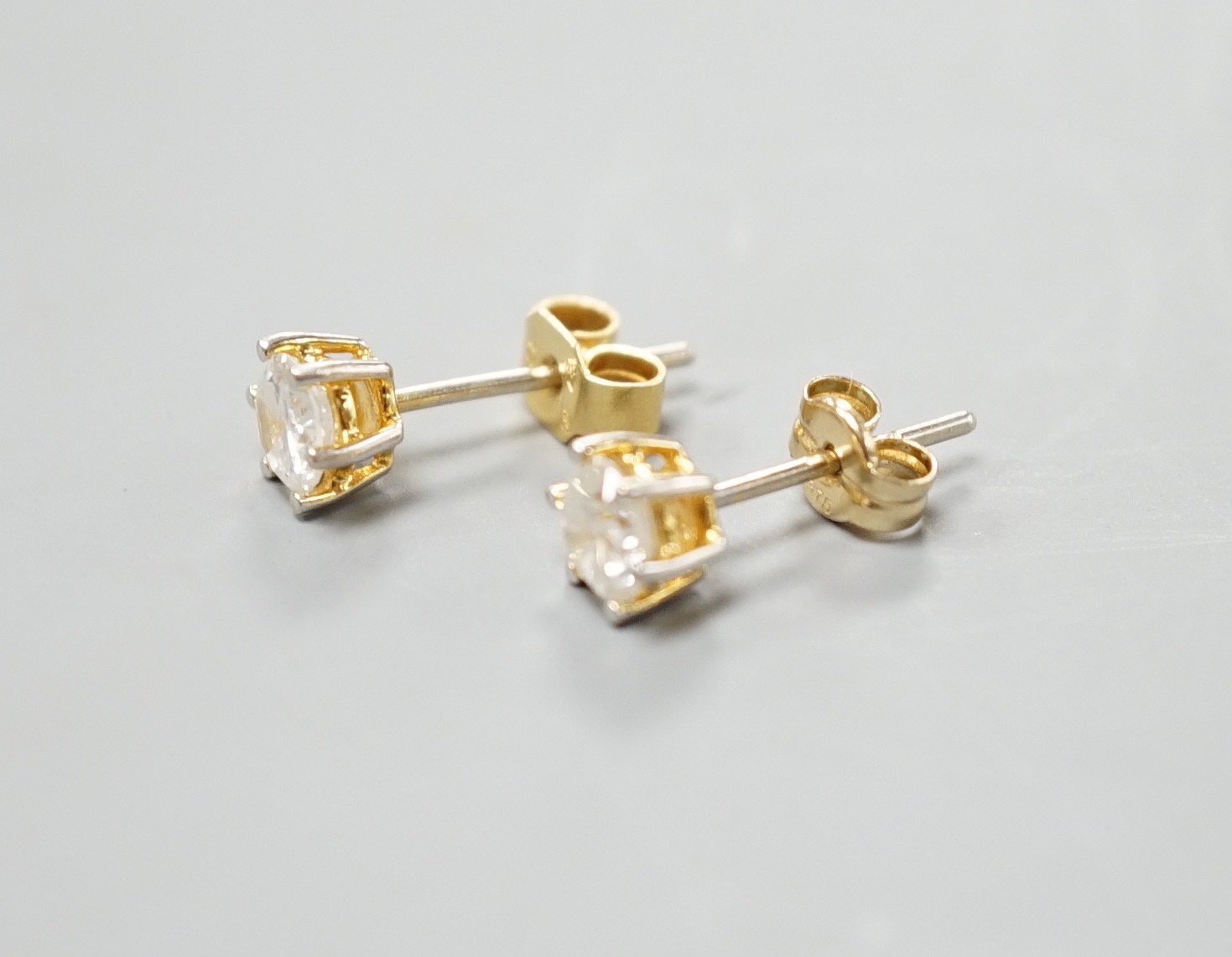 A pair of yellow metal and solitaire diamond set ear studs, gross weight 1.2 grams, each stone weighing approx. 0.33ct.